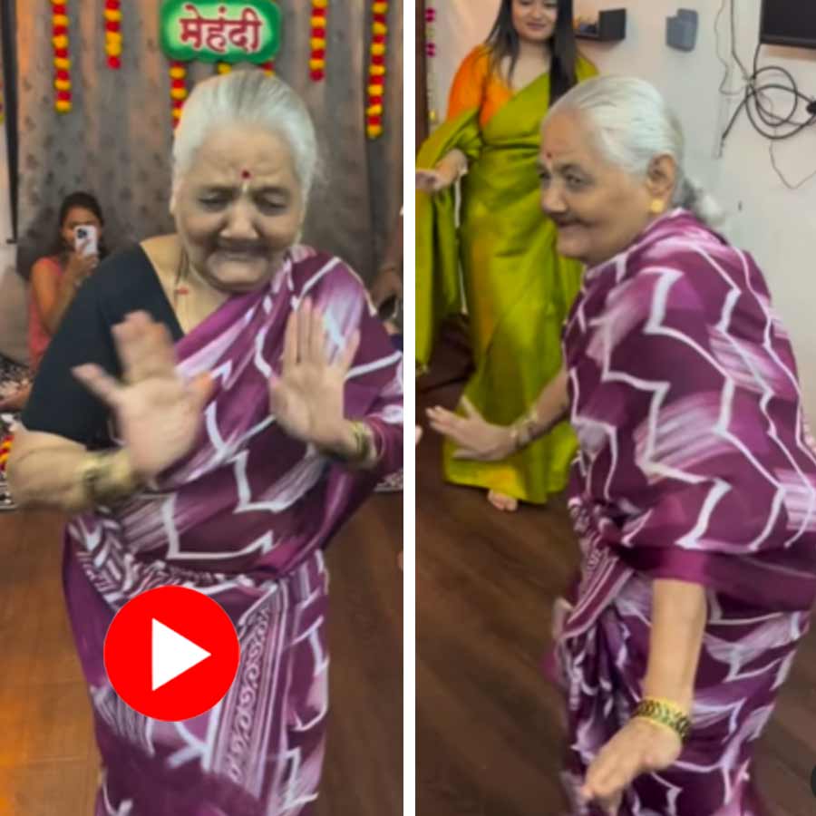 An elderly woman is seen dancing to Kajra Re