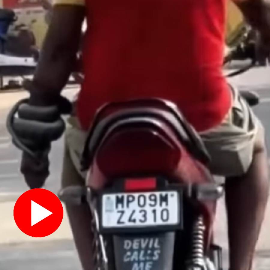 Video of a man riding a bike with a snake tangled in one hand goes viral dgtl