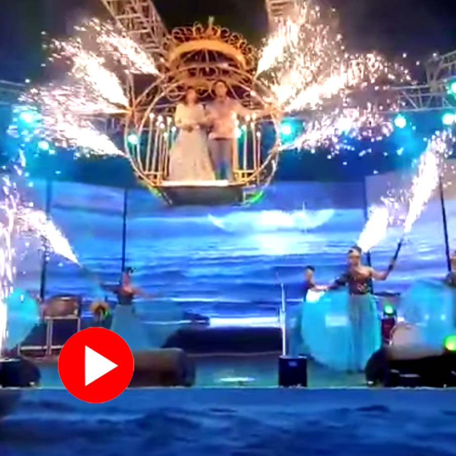 Video shows bride and groom fall on stage from cradle