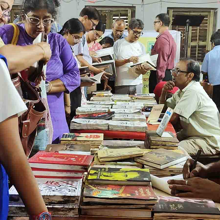 Book fair held on College Street with rain soaked books dgtl
