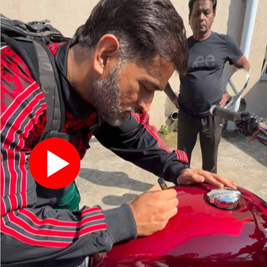Video of MS Dhoni Signing Fan’s Royal Enfield And Asking For Review Goes Viral dgtl