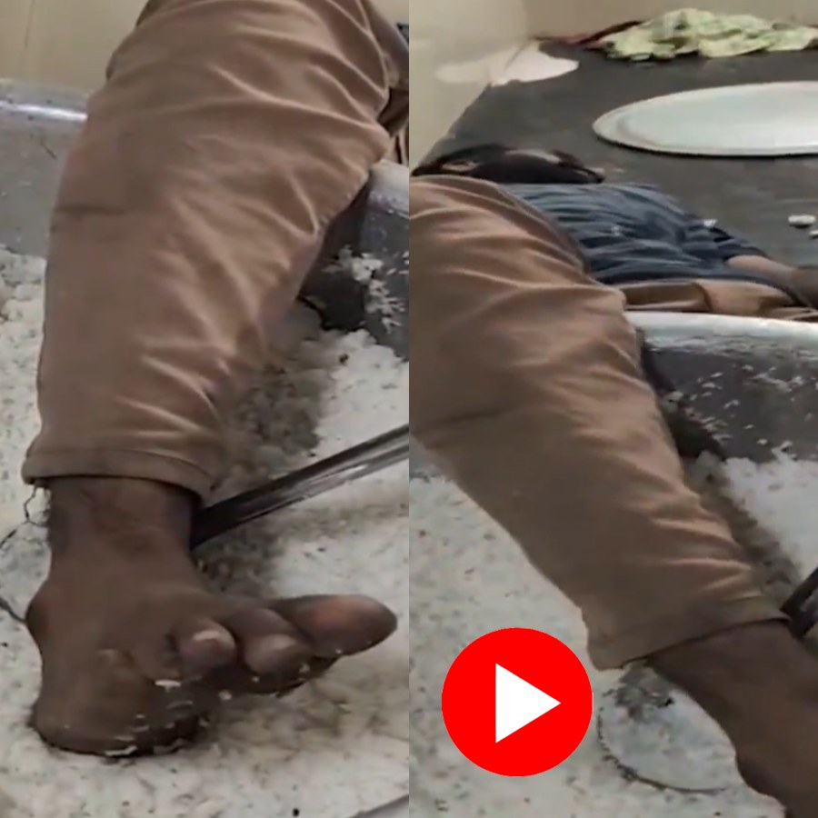 Video shows drunk college watchman sleeping inside kitchen by keeping leg inside rice pot, removed from duty