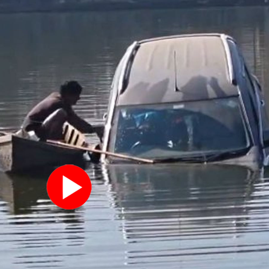 rescue a 25-year-old man from a car that sank into a highway-side pond