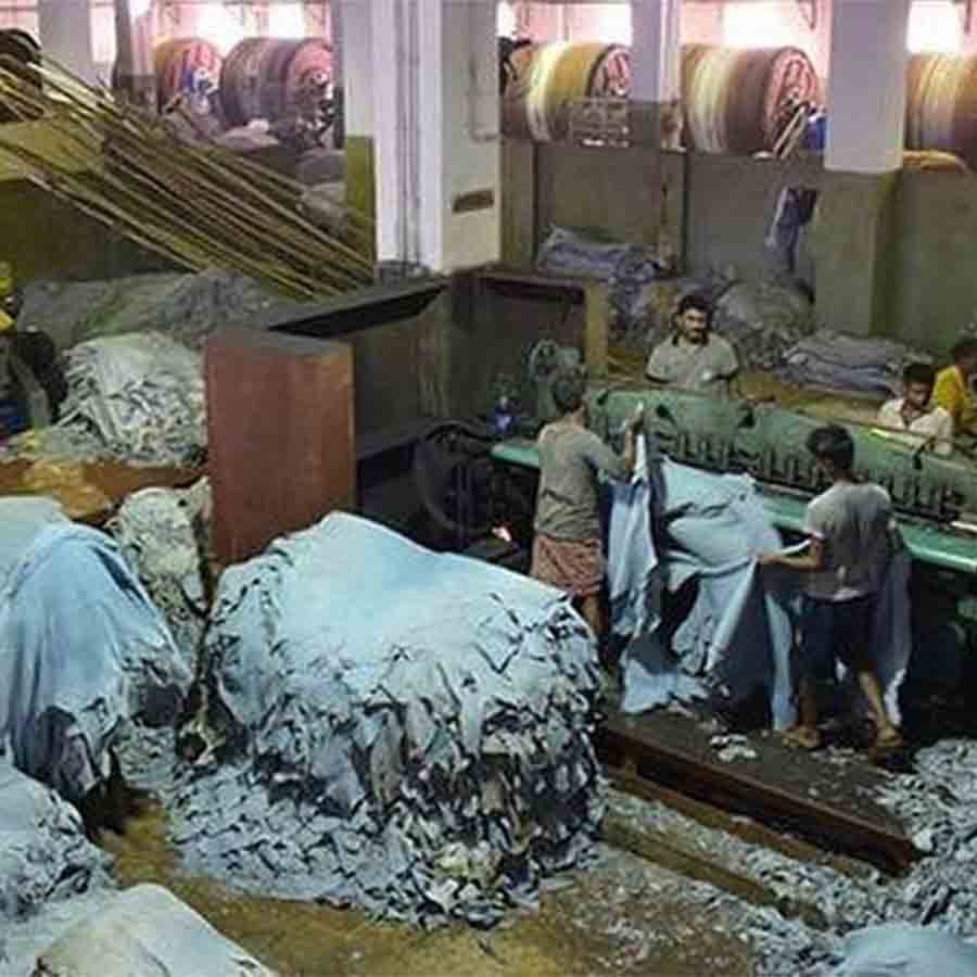 Migrant Labour from different States o India working together in a leather factory of Bhangar
