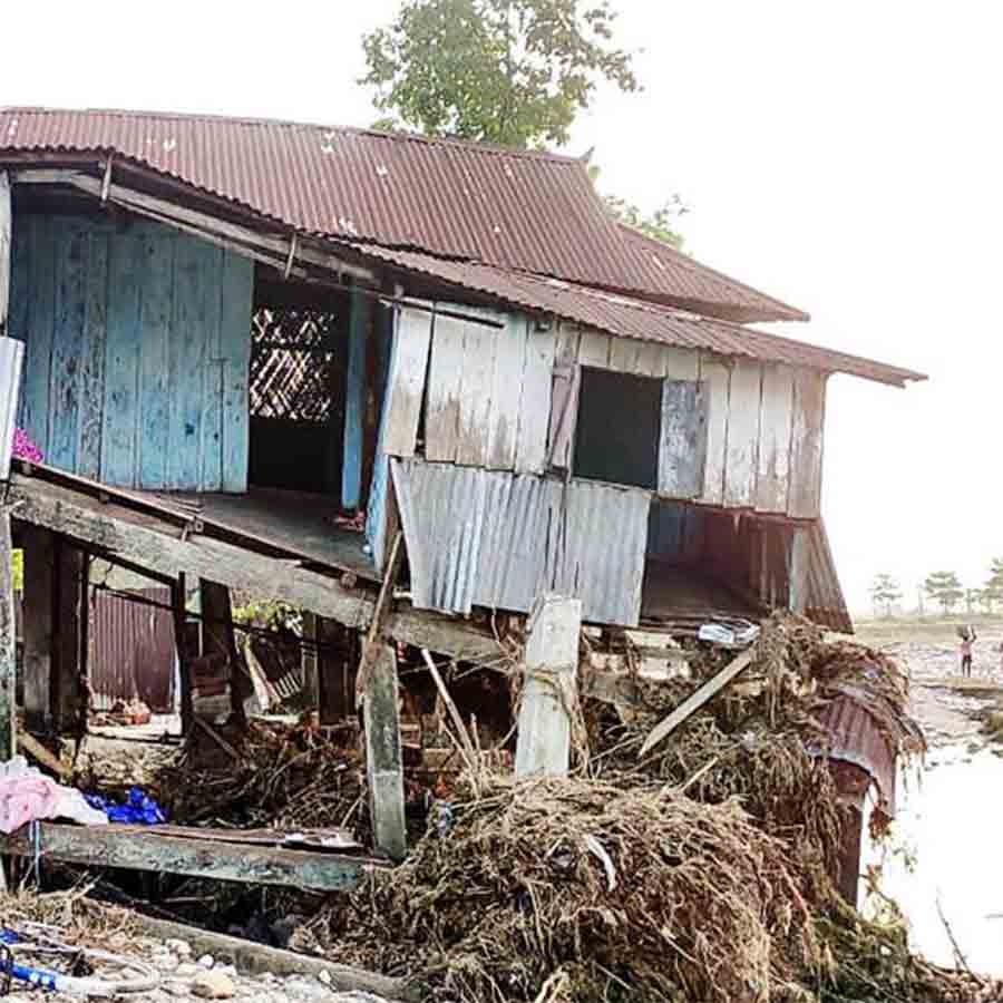 Rescue workers saved a woman and his child who was trapped in flood at nagrakata