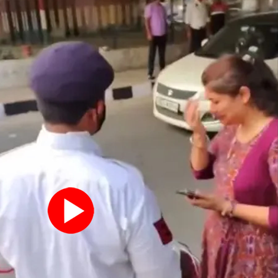 man trying to help a woman, but traffic rules enforcement catches him