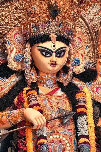 হাতের পঞ্চবাণ দিয়ে তিনি অসুর বধ করেন। 