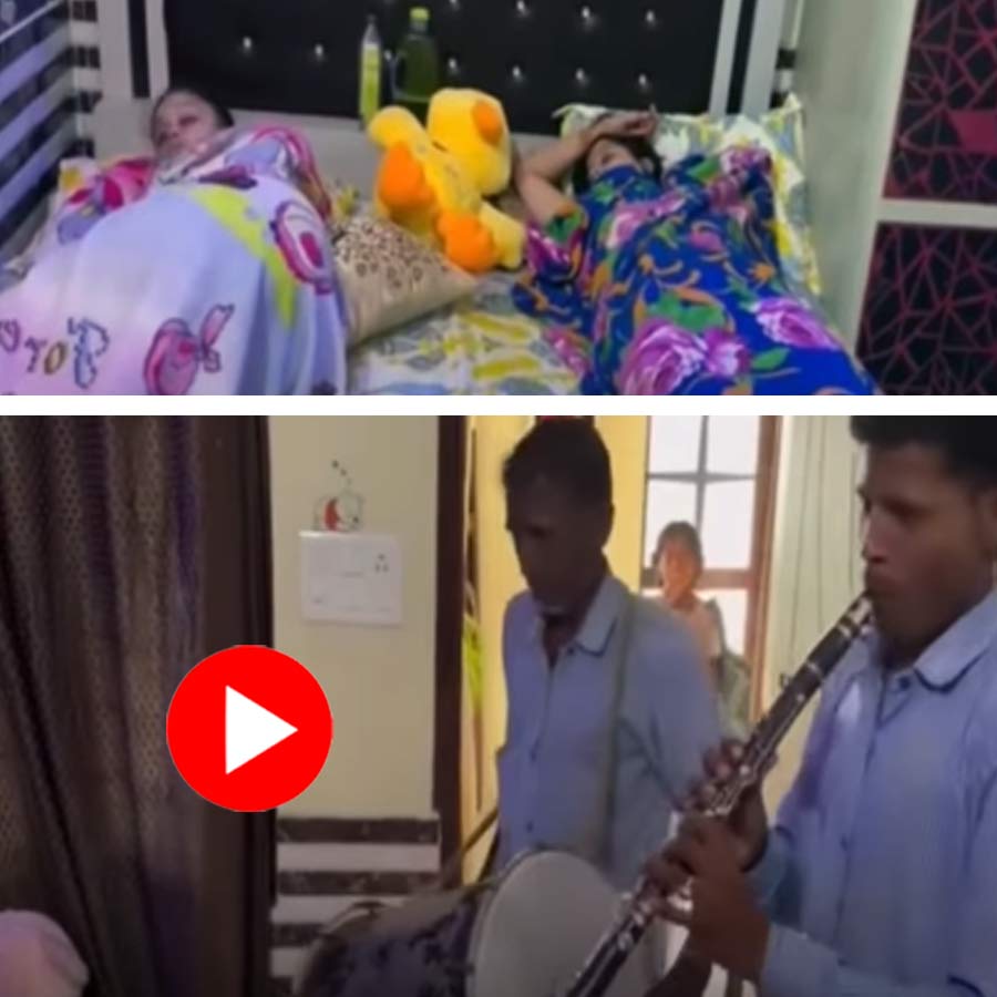 Video shows mother hires band party to wake up her two daughter