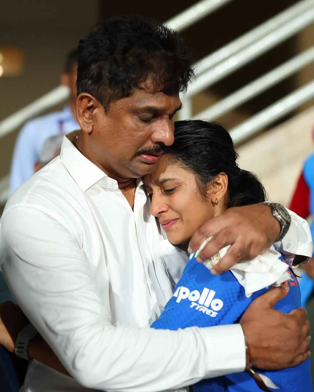 বাবার বুকে মুখ গুঁজে।