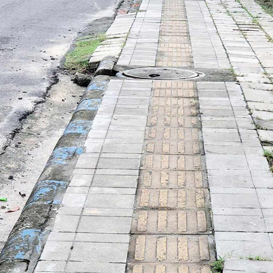 Questions are being raised about whether water is accumulating in New Town due to sidewalk defects