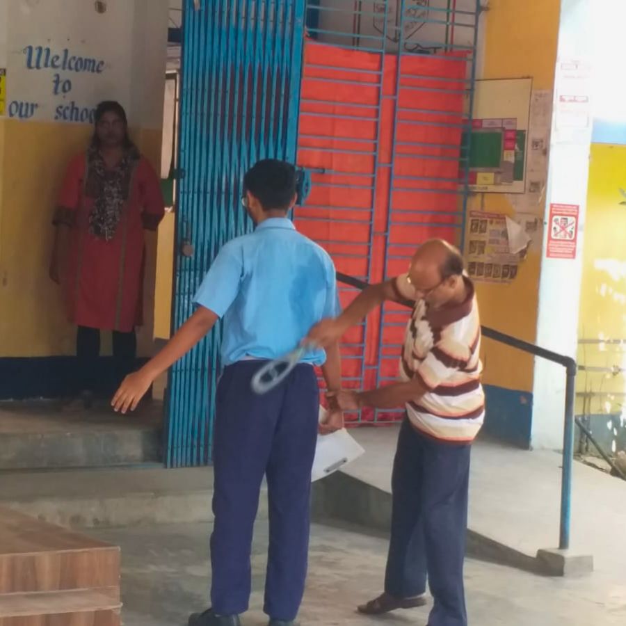 Body searches are conducted at the entrance to the examination hall.