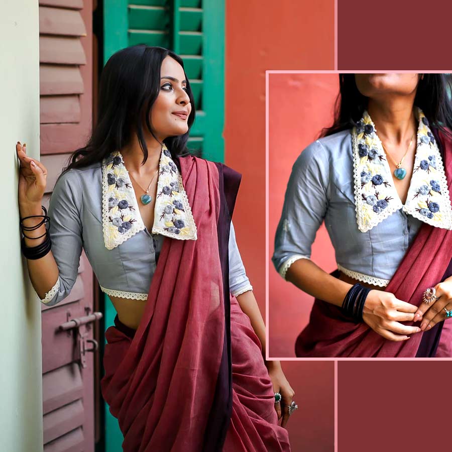 এ বার পুজোর ফ্যাশনে কলারযুক্ত ব্লাউজ় বেশ ‘ট্রেন্ডিং’। একরঙা মেরুন শাড়ির সঙ্গে যদি পরে ফেলেন ধূসর রঙের ব্লাউজ়। ব্লাউজ়ের কলার জুড়ে ফুলেল নকশা, সঙ্গে লেসের কারুকাজ। হাতে বোনা এমন ব্লাউজ় বানাতে সময় লাগে প্রায় ২-৩ দিন। এমন ব্লাউজ়ের কালেকশন আলমারিতে থাকলে যে কোনও গাঢ় রঙের শাড়ির সঙ্গে দিব্যি মানিয়ে যাবে। ‘মোনরি’র স্টোর এবং ওয়েবসাইটেও পেয়ে যাবেন এমন ব্লাউজ়ের অজস্র সম্ভার। পুজোয় প্রিয়জনের সঙ্গে ঠাকুর দেখাই হোক কিংবা পুজো মণ্ডপে আড্ডা— হাতে বোনা এমন ব্লাউজ় পরনে থাকলে লোকের নজর এড়ানো মুশকিল!