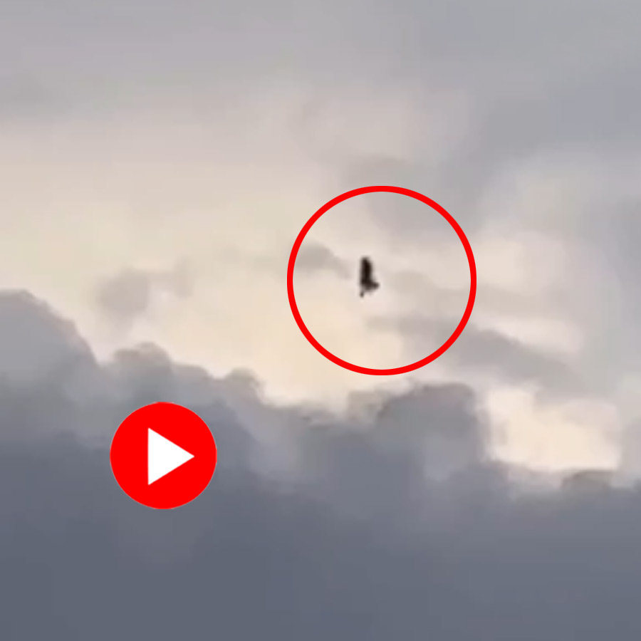 a shadowy figure rising into the sky