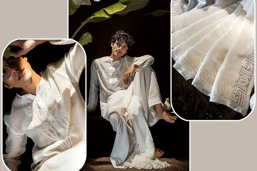এ বার পুজোয় ধুতি ও পাঞ্জাবির সাজে তাক লাগিয়ে দিতে পারেন। তার জন্য যদি হাতে আসে একেবারে নতুন কাপড় ও নকশা? লখনউয়ের চিকনকারীর কাজ করা কুর্তি ও শাড়ি তো দেখাই যায়, কিন্তু ধুতি-কুর্তায় এমন কাজ সম্পূর্ণ নতুন। সাদা চিকনকারীর কাজ করা এমন ধুতি-পাঞ্জাবির সেট থাকুক এ বারের অষ্টমী বা দশমীর রাতের জন্য। লখনউয়ের চিকনকারীতে বাঙালিয়ানার ছোঁয়া লক্ষ করা যায় এই পোশাকে।