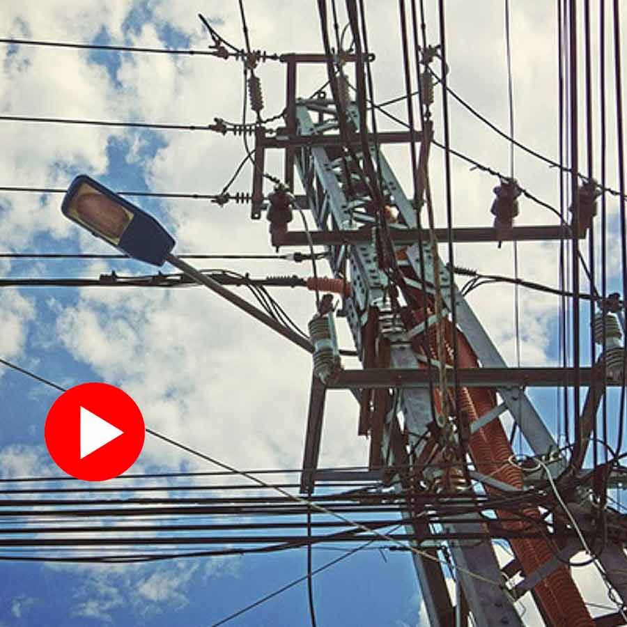 man climbed an electric tower