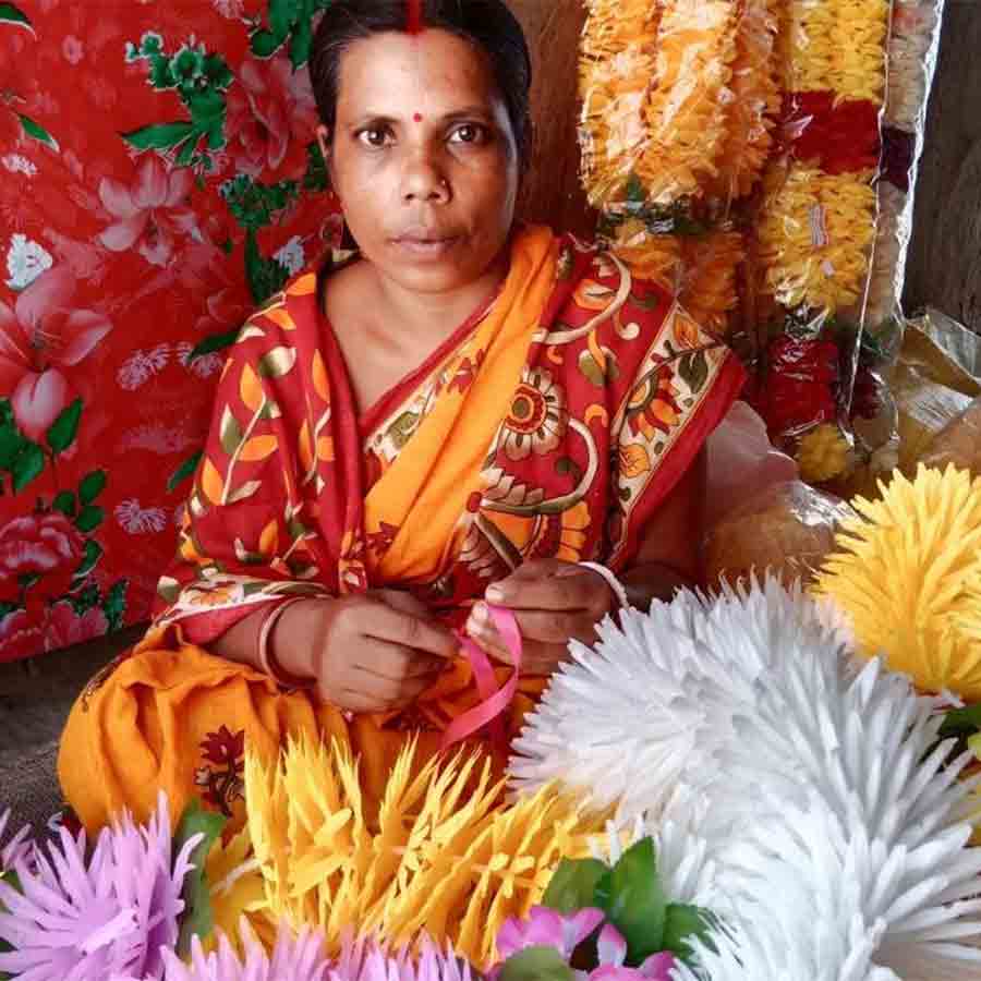 Sikha Garai of Guskara makes flower garlands to earn her living and raise her family