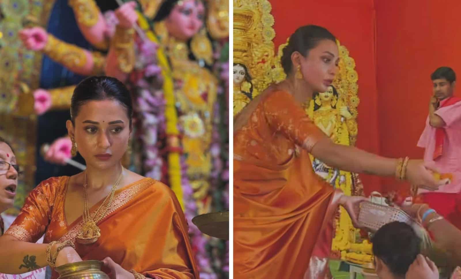 ১০।  গেরুয়া শাড়িতেই দীপ্তি ছড়ালেন মিমি চক্রবর্তী। অঞ্জলির ফুল বণ্টন থেকে শুরু করে গঙ্গাজল ছড়ানো, নিজের আবাসনের পুজোর সবটাই সামলালেন নিপুণ হাতে।   