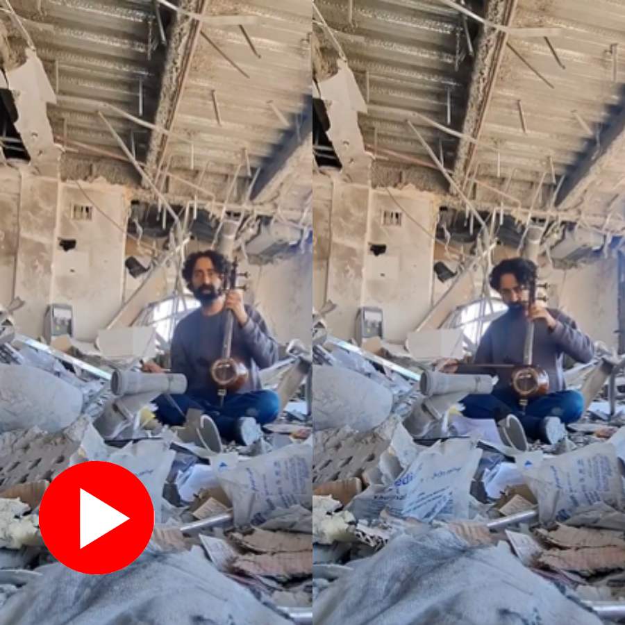 Video shows Iranian Musician playing musical instrument on his school ruins
