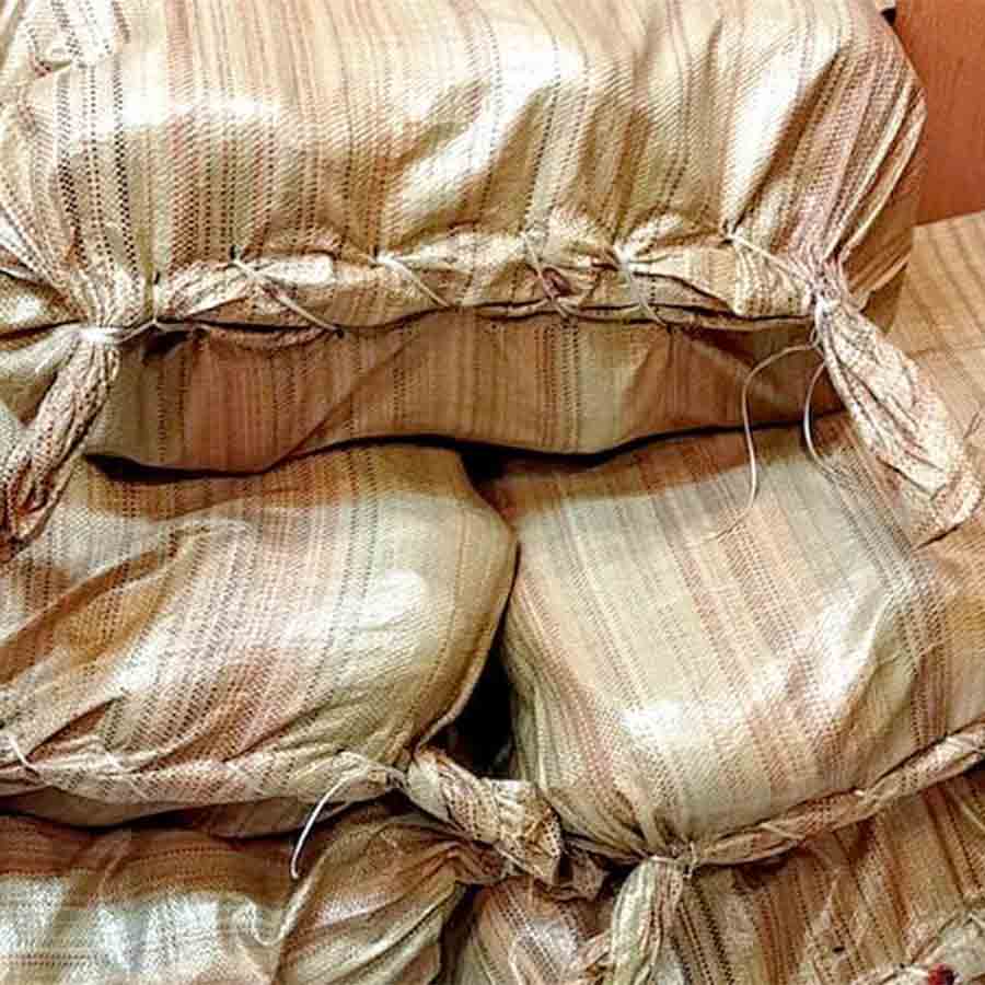 Weeds stacked inside Fish crate recovered from Chandannagar