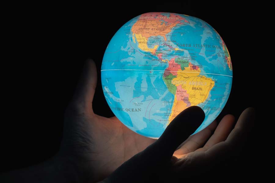 Why does Union Education Minister Dharmendra Pradhan propose to replace GMT with Mahakal Standard Time