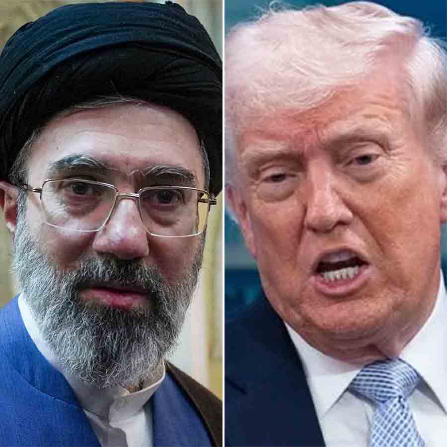 How does Iran control the Strait of Hormuz under international law even though Oman is on one side of it 