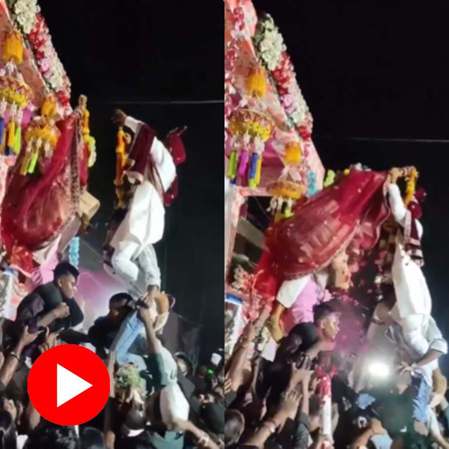 Video shows bride and groom engaged in competition to put garland on each other in wedding ceremony