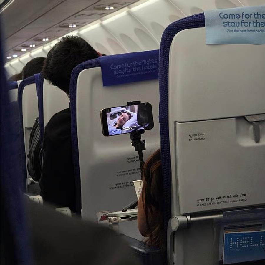 Video of Indigo Woman Passenger Using Tripod To Watch Series On Flight Seat Goes Viral dgtl