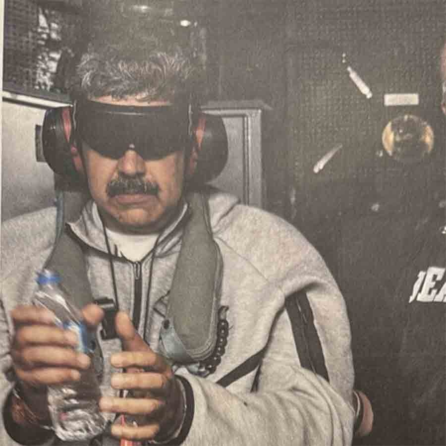 US President Donald Trump releases photo of Venezuelan president being loaded onto US ship and taken to New York