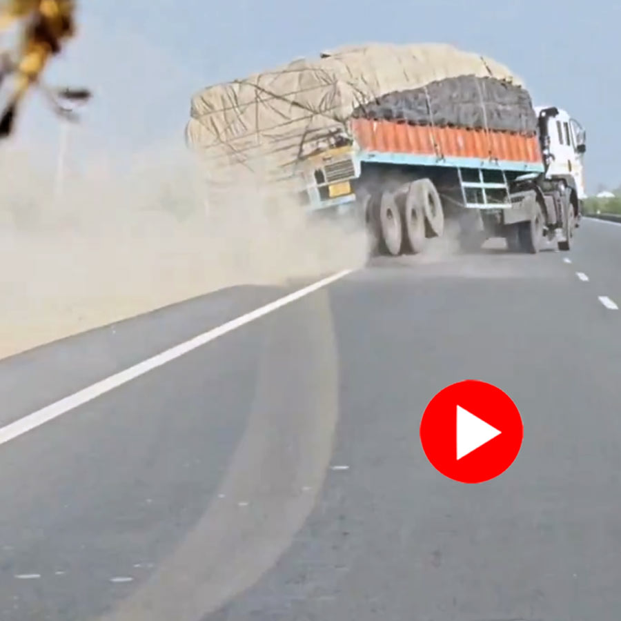 a truck lost control and overturned, scattering its load across the road