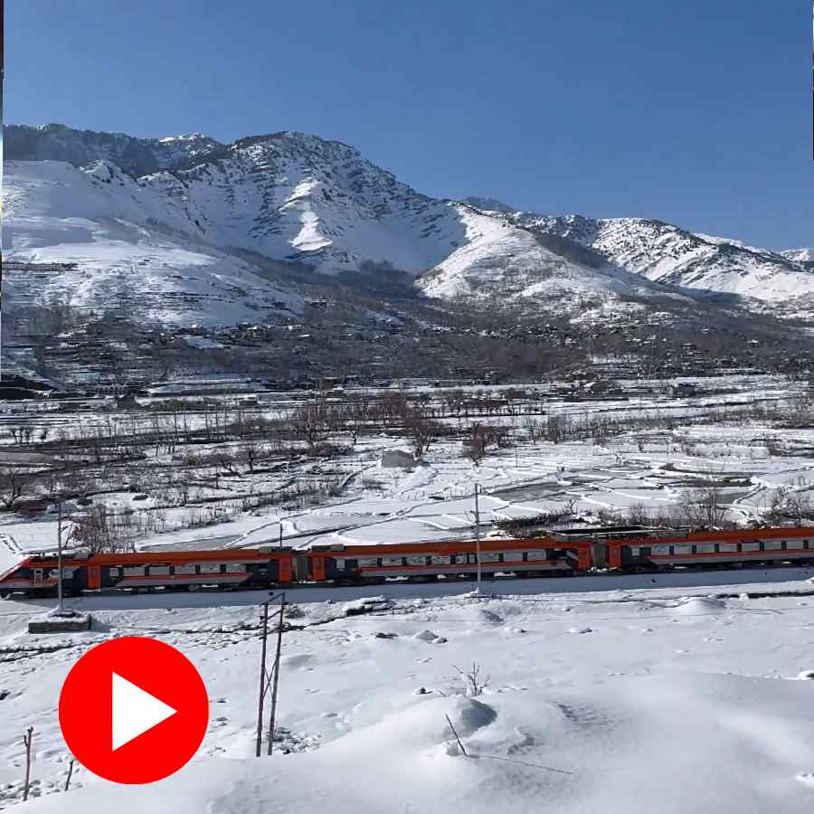 Vande Bharat Express gliding through a snowy valley