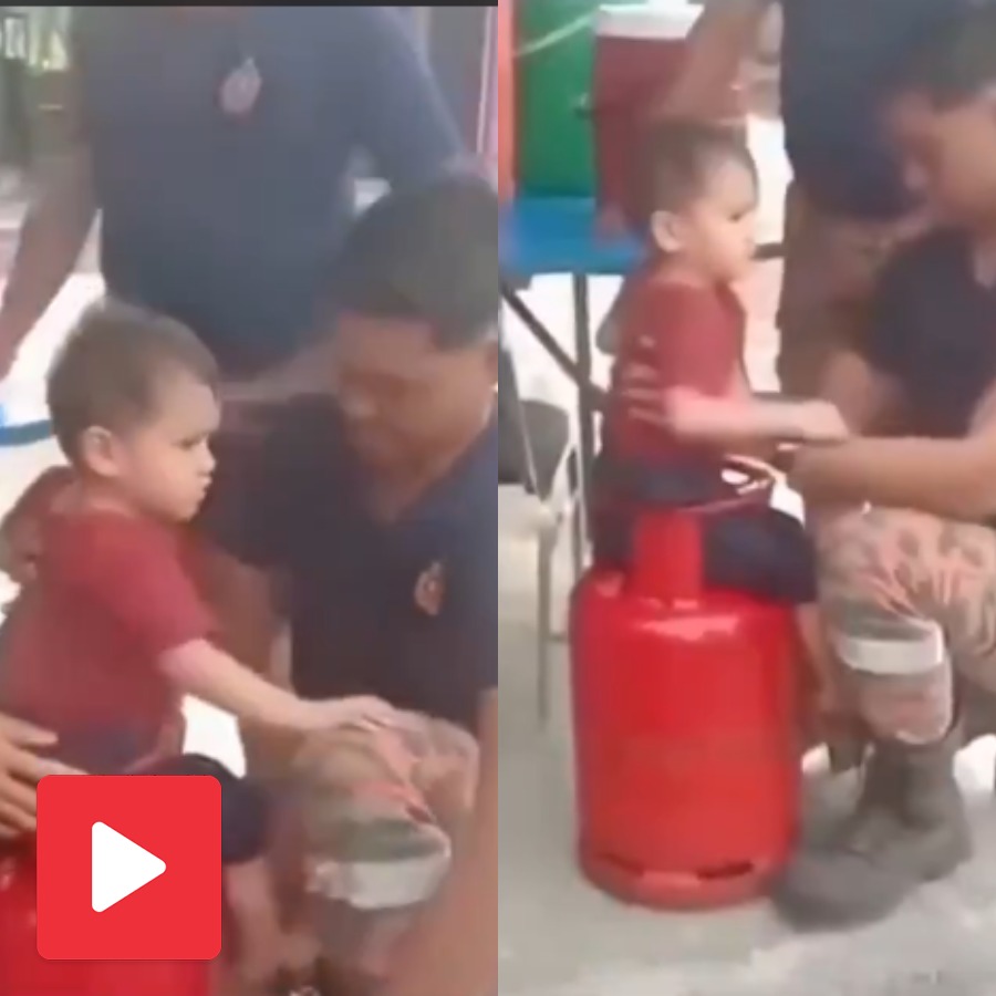 Video shows a child trapped in cylinder handle in a funny way