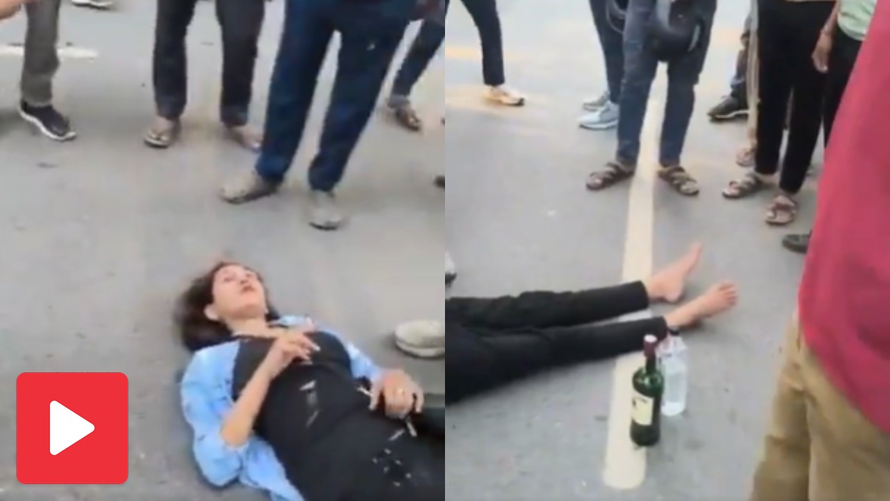 Video shows drunk woman lying on road and smoking in Greater Noida