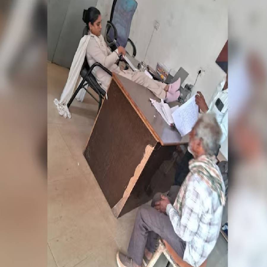 A woman constable suspended after a viral photograph showed her with both feet on a desk dgtl