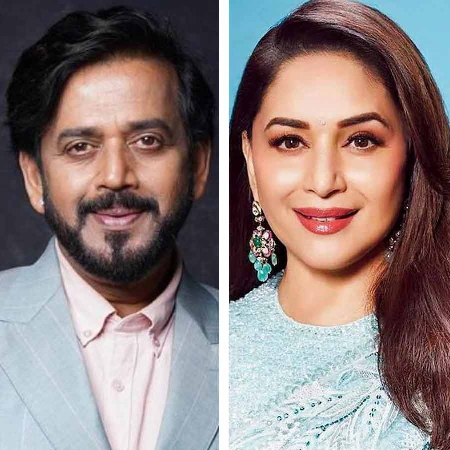 (বাঁ দিকে) রবি কিশন, (ডান দিকে) মাধুরী দীক্ষিত।