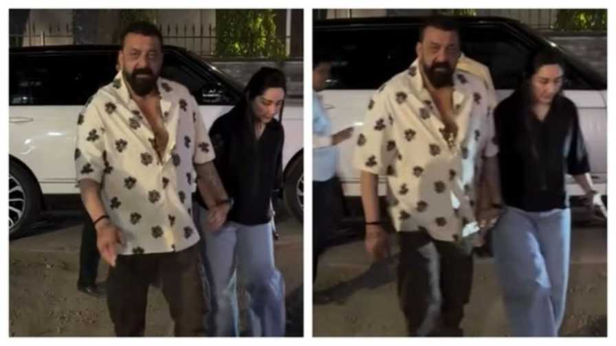 সঞ্জয়কে হাত ধরে নিয়ে যাচ্ছেন মান্যতা।