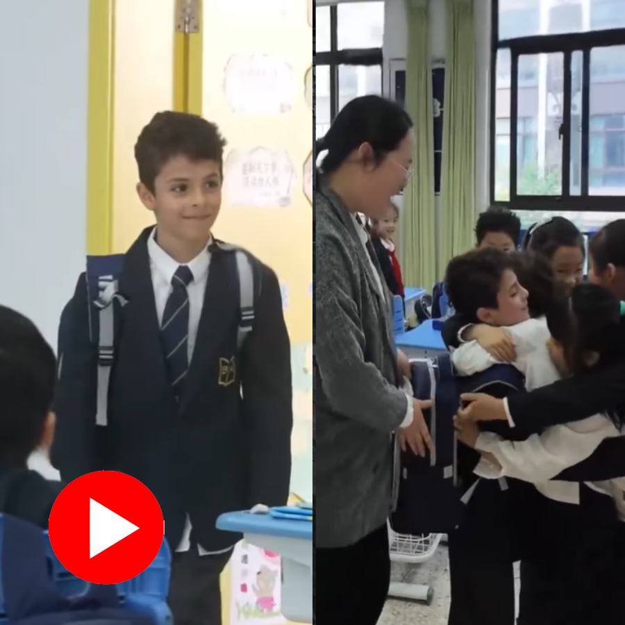 Video shows little friends hug eight-year-old Iranian boy tightly after he return to school after 42 days
