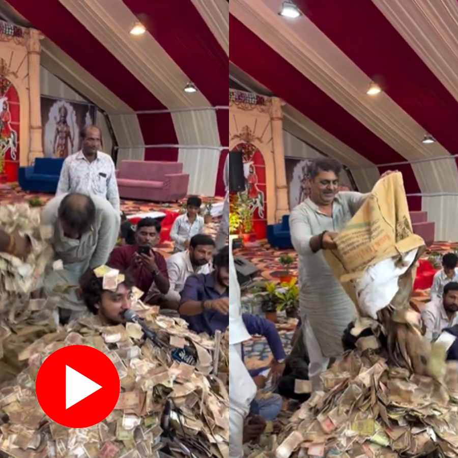 Video shows Gujarat Bhajan singer buried under lots of cash during devotional event