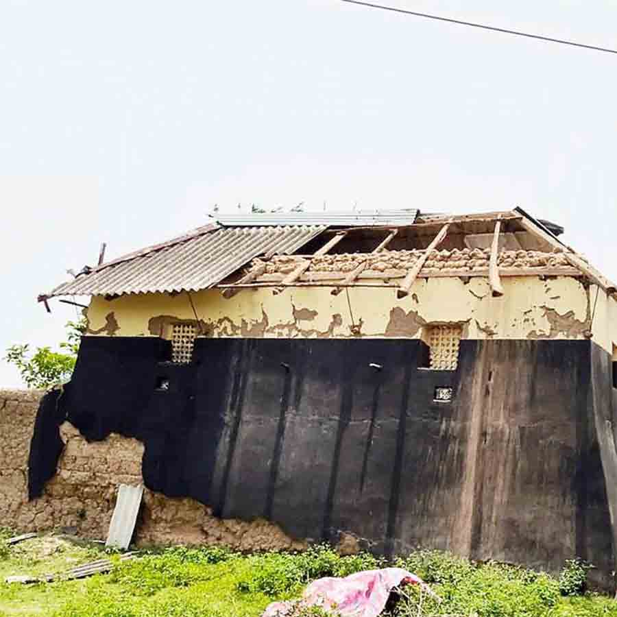 Storm damaged houses and electric posts at Bolpur