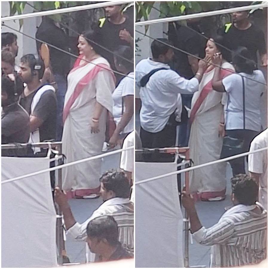 নব্বইয়ের ম্যাজিক আরও গাঢ় হল অপরাজিতা আঢ্য এসে দাঁড়াতেই। চওড়া লাল পাড়ের সাদা শাড়ি। কোমরছোঁয়া চুলে বিনুনি। কপালে বড় সিঁদুরে টিপ। বারকয়েক শট দিলেন তিনি।