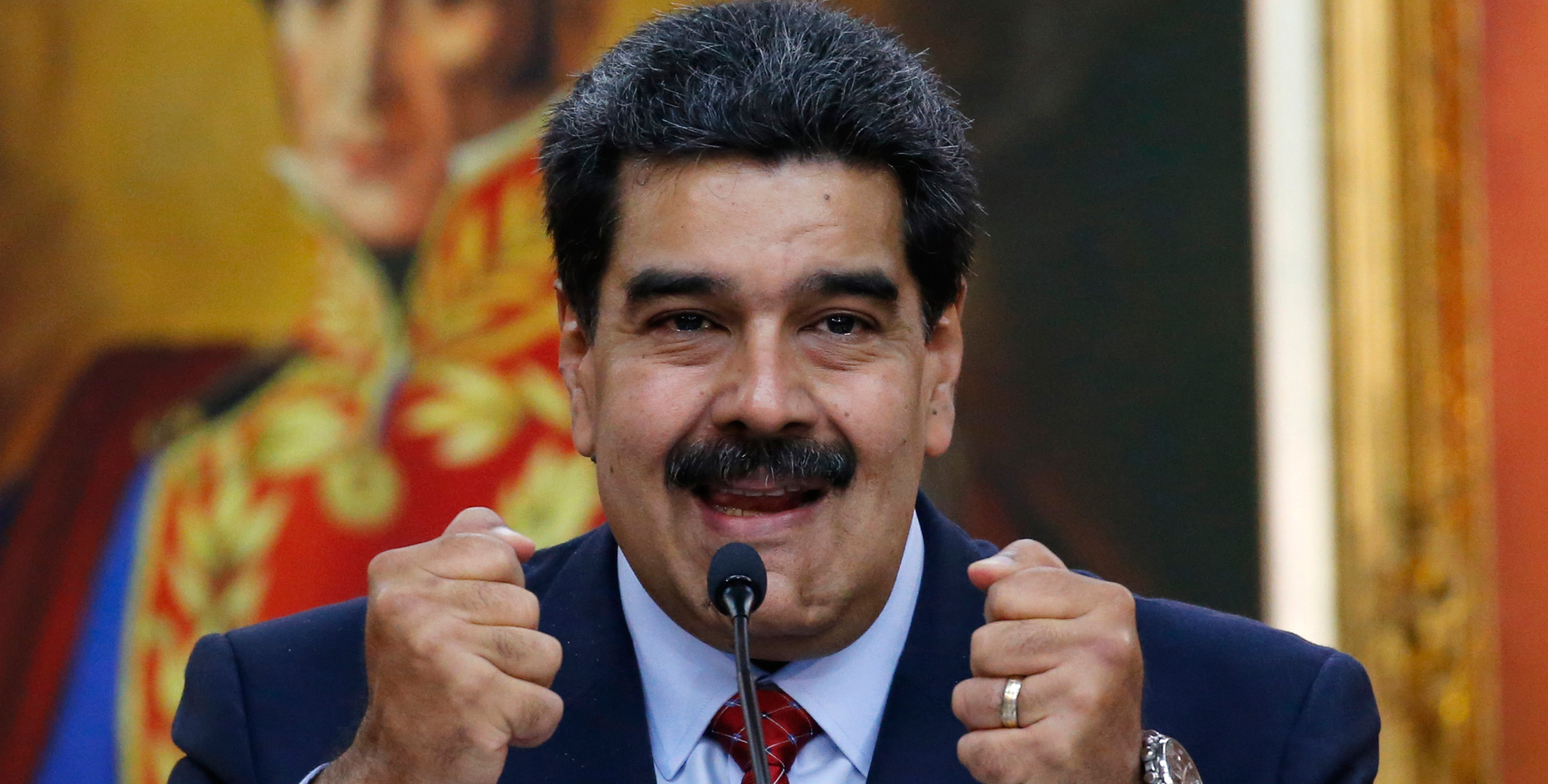 Venezuelan President Nicolas Maduro holds up his fists during a press conference at Miraflores presidential palace in Caracas, Venezuela on Friday, January 25, 2019, amid a political power struggle with an opposition leader who has declared himself interim president.