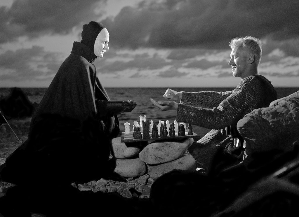 A still from The Seventh Seal (1957), where the knight, played by Max von Sydow, challenges Death to a game of chess