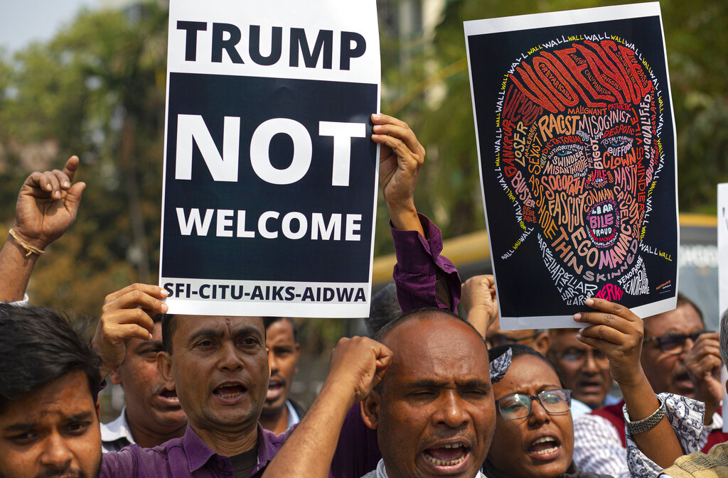 Indian activists shout slogans against U.S. President Donald Trump during his India visit, in Gauhati, on Monday. Indian Prime Minister Narendra Modi’s Hindu nationalist government is pulling out all the stops, at an expense of more than $14 million, to woo the president and first lady Melania Trump. But experts have said that very little of substance will be achieved for either side beyond the pageantry and symbolism.