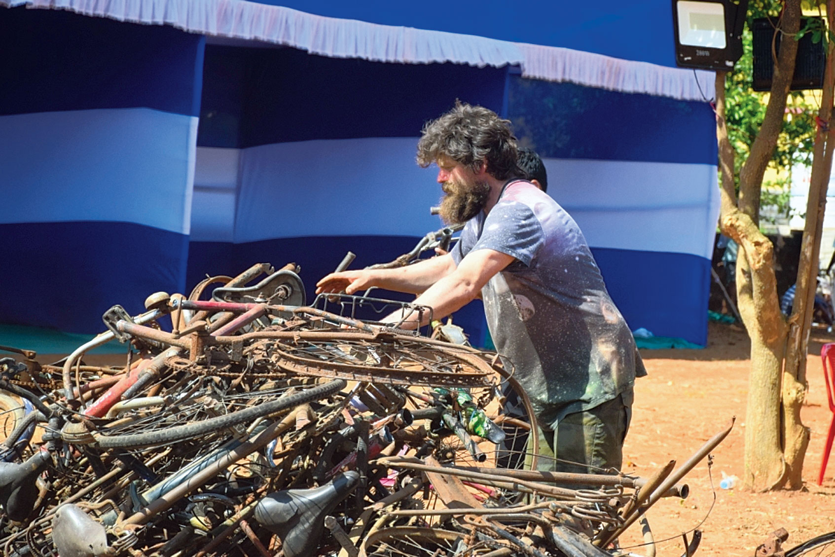Participants create art from waste at the symposium at Kalinga Nagar in Bhubaneswar on Thursday.