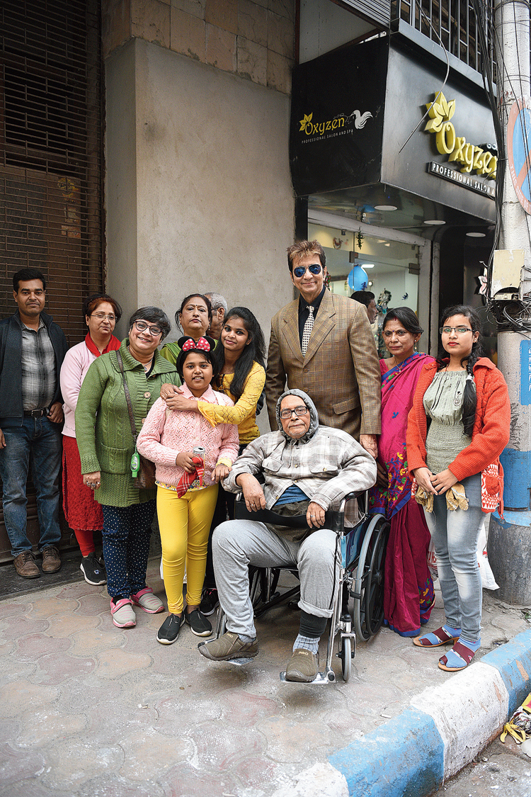 Lunch star: At 3.30pm, at least 30 people were waiting outside Peter Cat. A large group came out of the restaurant around 3.50pm. The star attraction of the group from Salt Lake was an 80-year-old man bound to a wheelchair. P.N. Bhaduri, a former IAS officer who was once the deputy secretary at Raj Bhavan, had come with his family and friends. “Park Street is nostalgia for him. "He is a man of varied interests. His mobility has been affected, not his zest for life,” said Guru Prasad Banerjee, former assistant commissioner of Calcutta police (in brown suit) and part of the same group.