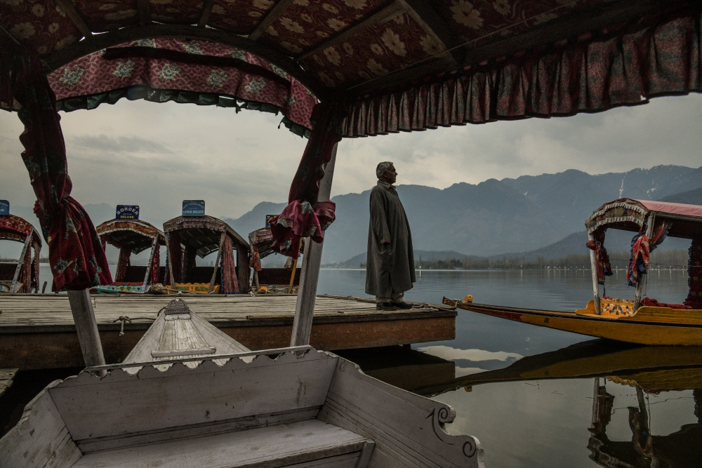 Shikara owners wait at the Dal Lake for customers March 17, 2020. The six month tourist season sustains them for the year.