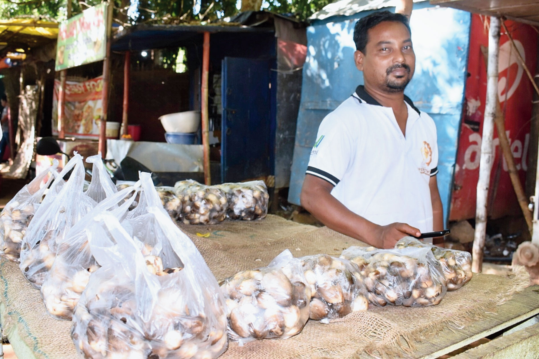 A mushroom vendor uses plastic bags at Unit-IV in Bhubaneswar on Thursday.