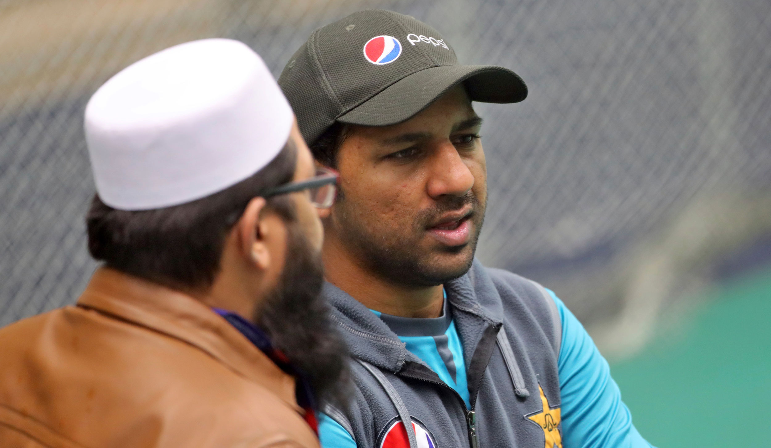 Pakistan cricket chief selector Inzamam-ul-Haq (left) listens to captain Sarfaraz Ahmed during a training session ahead of their ICC Cricket World Cup match against India at Old Trafford in Manchester, on June 15, 2019. 
