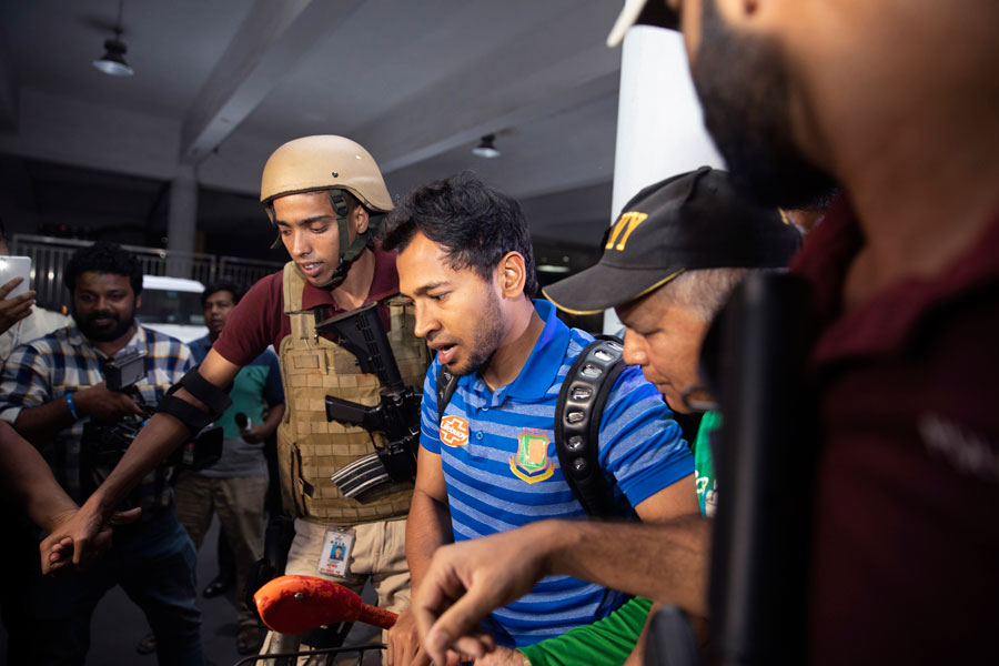 Bangladeshi cricketer Mushfikur Rahim with other team players come out from the VIP terminal in Hazrat Shahjalal International Airport, Dhaka. Bangladesh's cricket team arrived home on Saturday after its tour of New Zealand was abandoned following the Christchurch mosque shootings a day earlier.