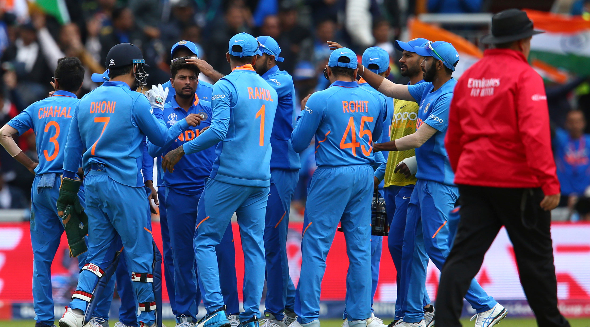 Kuldeep Yadav (third from left) celebrates with his teammates after taking the wicket of Pakistan's Babar Azam during the ICC Cricket World Cup match between India and Pakistan at Old Trafford in Manchester, England, on June 16, 2019. 