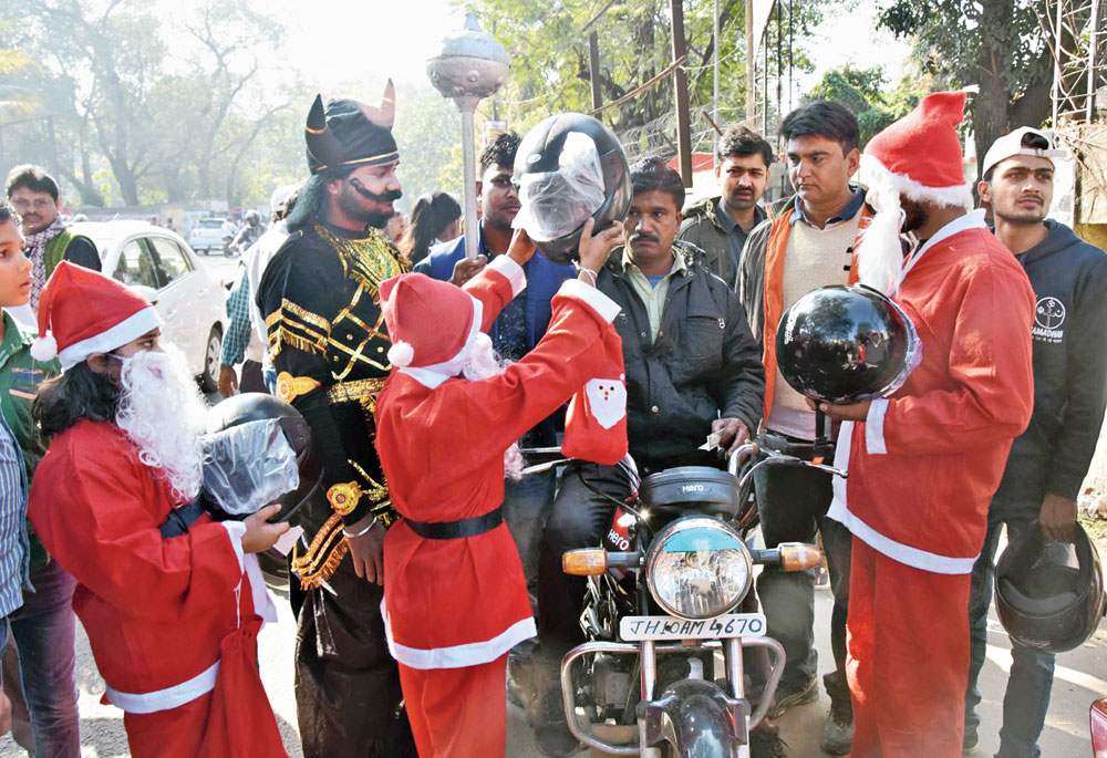 Volunteers of Jharia NGO Samadhan dressed as Santa Claus spread road safety awareness in Dhanbad
